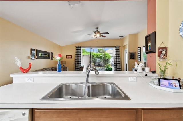 kitchen featuring lofted ceiling, kitchen peninsula, dishwasher, ceiling fan, and sink