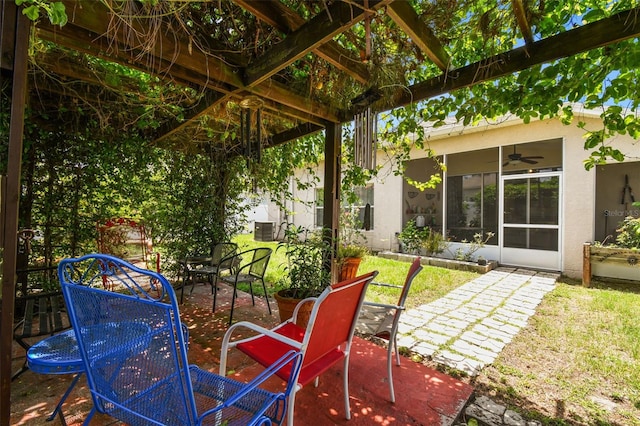 view of patio / terrace featuring ceiling fan and a pergola