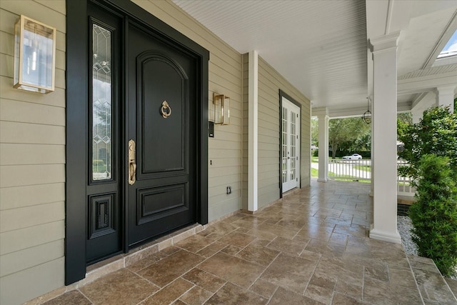 doorway to property featuring a porch