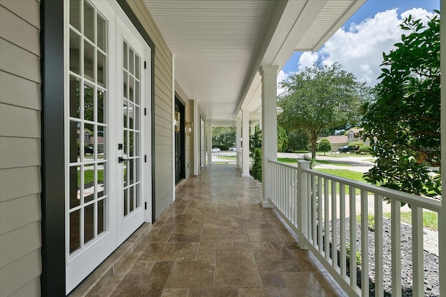 638 Limona Woods Dr, Brandon, FL 33510 - view of patio featuring french doors and a porch