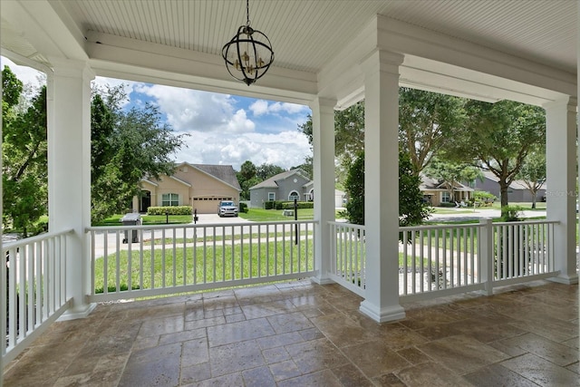 view of terrace featuring a garage and covered porch