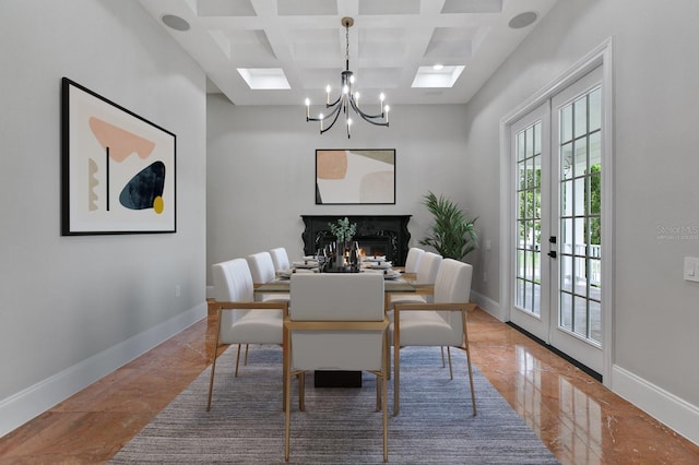 tiled dining room featuring beamed ceiling, coffered ceiling, plenty of natural light, and a fireplace