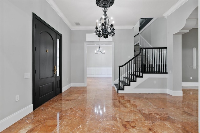 638 Limona Woods Dr, Brandon, FL 33510 - entryway with crown molding, baseboards, stairs, marble finish floor, and a notable chandelier