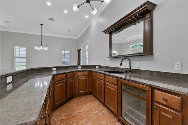 kitchen featuring crown molding, tile flooring, an inviting chandelier, beverage cooler, and sink