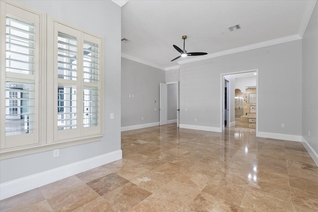 tiled empty room featuring ornamental molding and ceiling fan