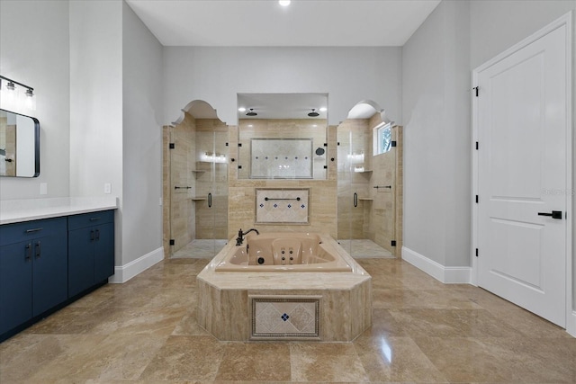 bathroom featuring plus walk in shower, tile flooring, and vanity