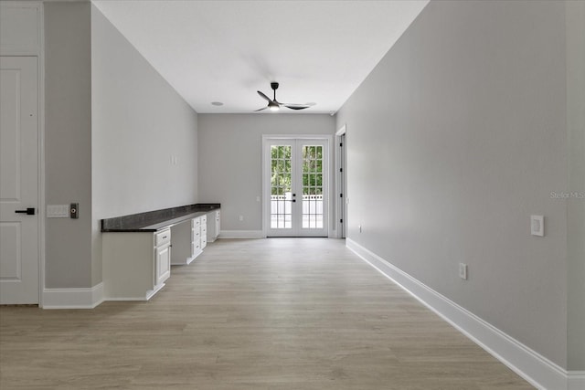 unfurnished living room with light hardwood / wood-style floors, french doors, and ceiling fan