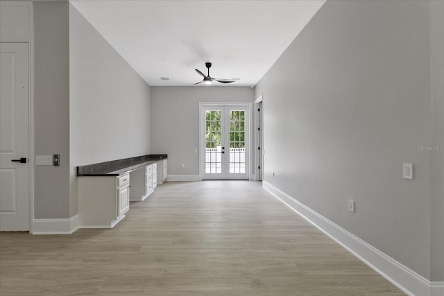 638 Limona Woods Dr, Brandon, FL 33510 - unfurnished living room with baseboards, ceiling fan, french doors, and light wood finished floors