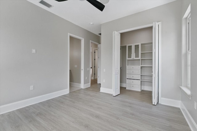 638 Limona Woods Dr, Brandon, FL 33510 - unfurnished bedroom featuring light wood finished floors, baseboards, visible vents, and ceiling fan