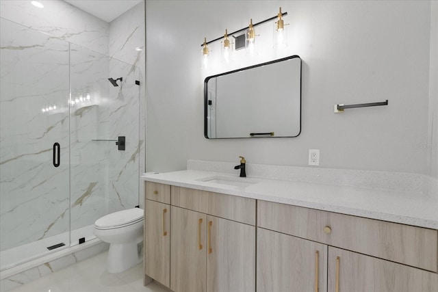 bathroom featuring walk in shower, vanity, toilet, and tile floors