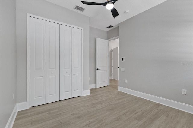 unfurnished bedroom featuring a closet, ceiling fan, and light hardwood / wood-style floors