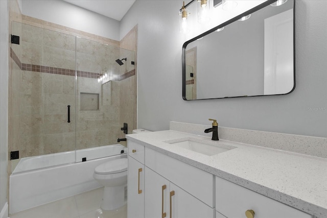 full bathroom featuring combined bath / shower with glass door, vanity, toilet, and tile floors