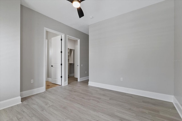 unfurnished room featuring ceiling fan and light hardwood / wood-style flooring