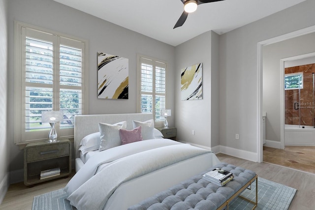 tiled bedroom featuring ceiling fan and multiple windows