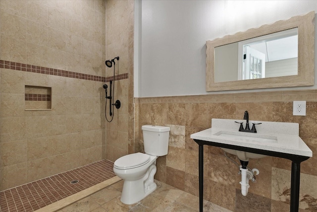 bathroom featuring tile walls, a tile shower, backsplash, and toilet