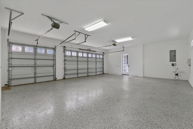 638 Limona Woods Dr, Brandon, FL 33510 - garage featuring a garage door opener and electric panel