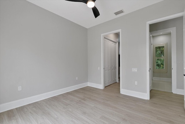 638 Limona Woods Dr, Brandon, FL 33510 - unfurnished bedroom featuring baseboards, visible vents, and light wood-style floors