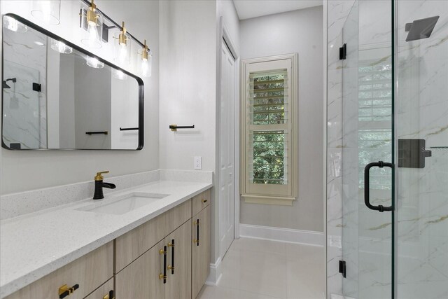 bathroom featuring tile floors, a shower with door, and large vanity