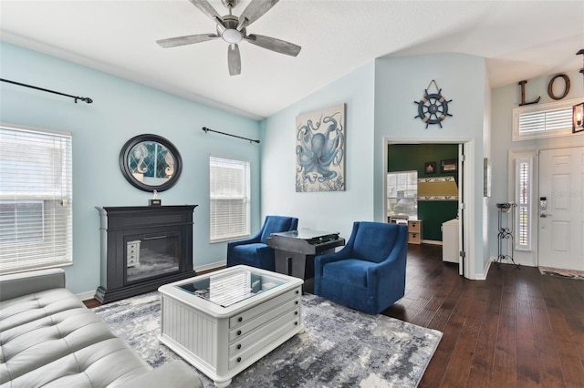 living room featuring ceiling fan, lofted ceiling, and dark hardwood / wood-style flooring