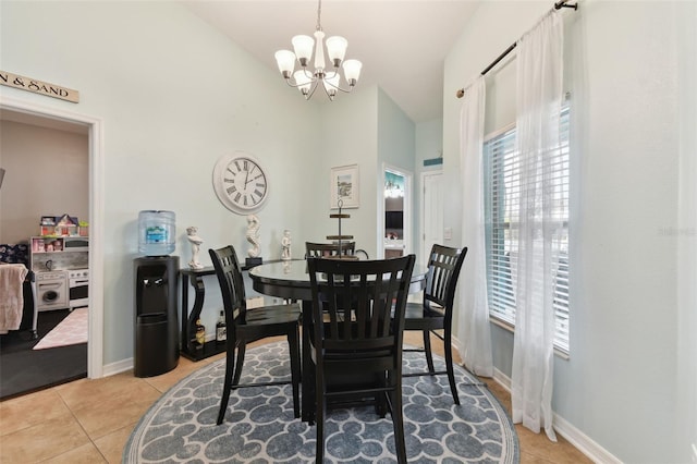 tiled dining area featuring an inviting chandelier