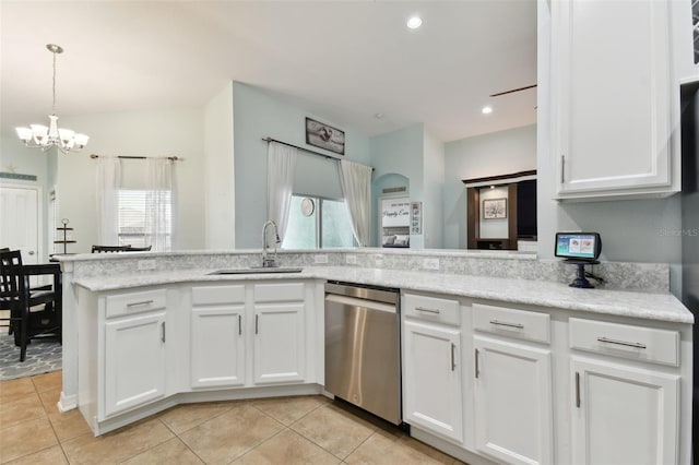 kitchen featuring sink, white cabinetry, decorative light fixtures, stainless steel dishwasher, and kitchen peninsula