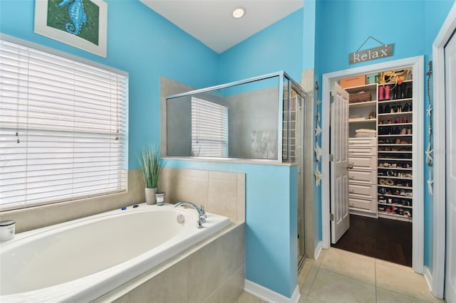 bathroom with separate shower and tub and tile patterned floors