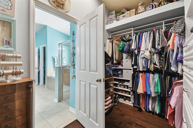 spacious closet with tile patterned flooring