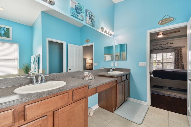 bathroom with ceiling fan, vanity, and tile patterned flooring