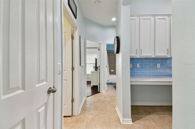 hallway with light tile patterned floors