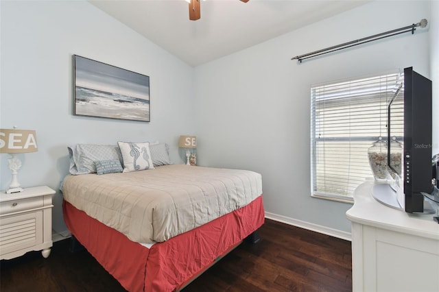 bedroom featuring dark hardwood / wood-style flooring, lofted ceiling, and ceiling fan