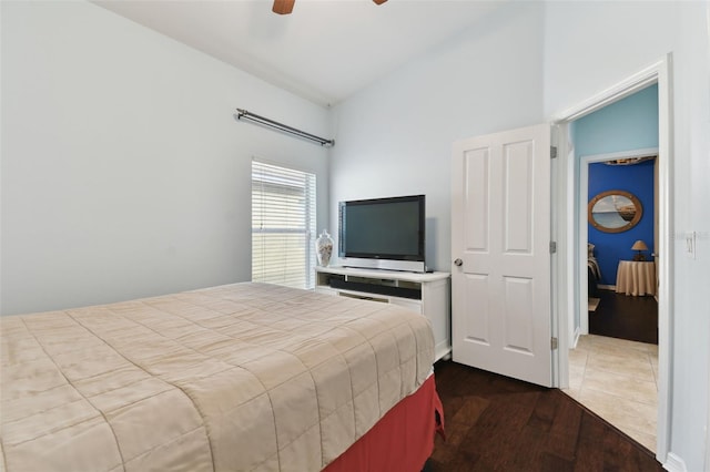 bedroom featuring lofted ceiling, wood-type flooring, and ceiling fan