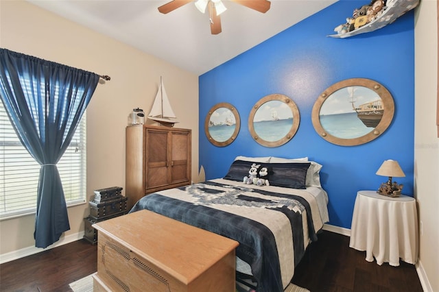 bedroom with ceiling fan and dark hardwood / wood-style flooring