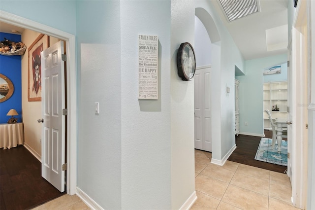 hallway with light tile patterned floors