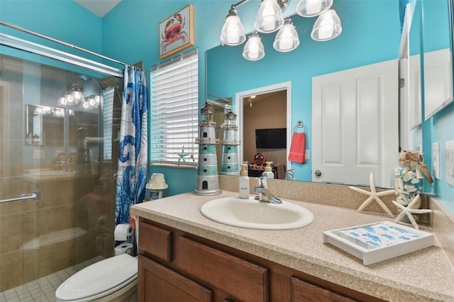 bathroom with vanity, toilet, and walk in shower