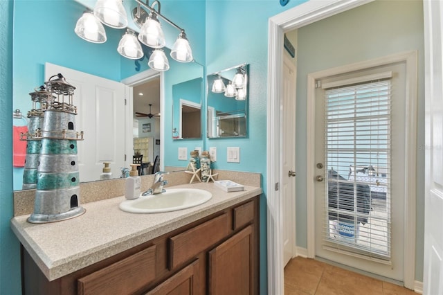 bathroom featuring tile patterned flooring, vanity, and ceiling fan