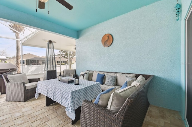 view of patio / terrace featuring ceiling fan and outdoor lounge area