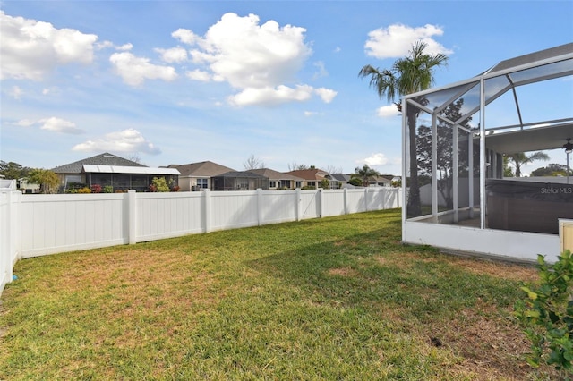 view of yard featuring a lanai