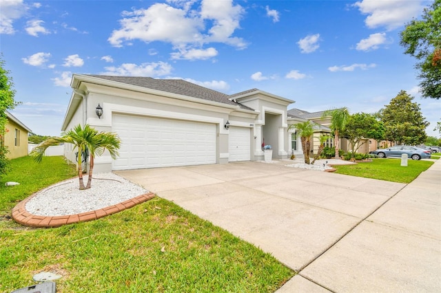 6843 Boulder Run Loop, Wesley Chapel, FL 33545 - view of front of property featuring concrete driveway, an attached garage, a front yard, and stucco siding