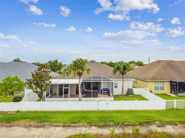 6843 Boulder Run Loop, Wesley Chapel, FL 33545 - rear view of house with glass enclosure and a sunroom