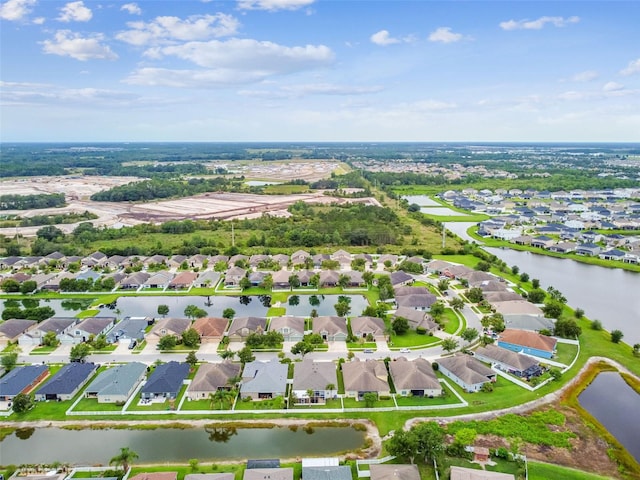 6843 Boulder Run Loop, Wesley Chapel, FL 33545 - aerial overview of property's location with property boundaries highlighted, nearby suburban area, and a large body of water