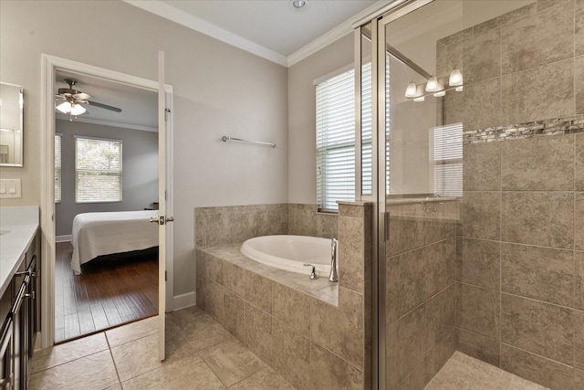 bathroom with tile patterned flooring, ornamental molding, and a wealth of natural light