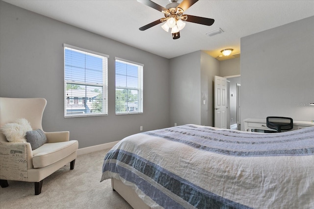 bedroom featuring ceiling fan and light carpet