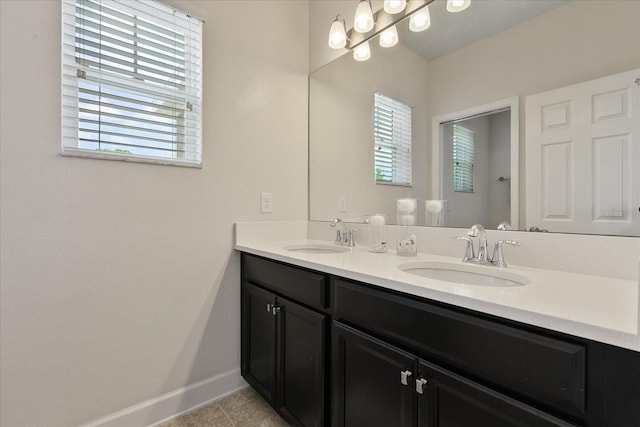 bathroom featuring tile patterned floors, plenty of natural light, and vanity