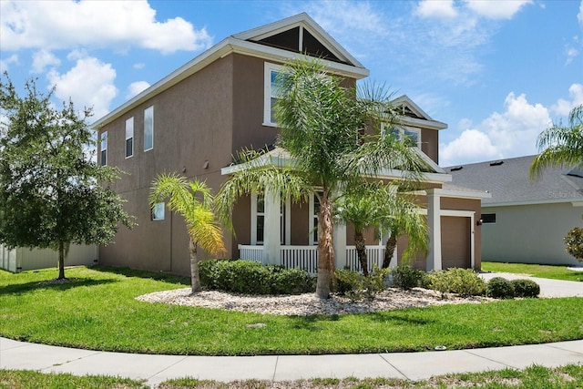 view of front of property with covered porch and a front lawn