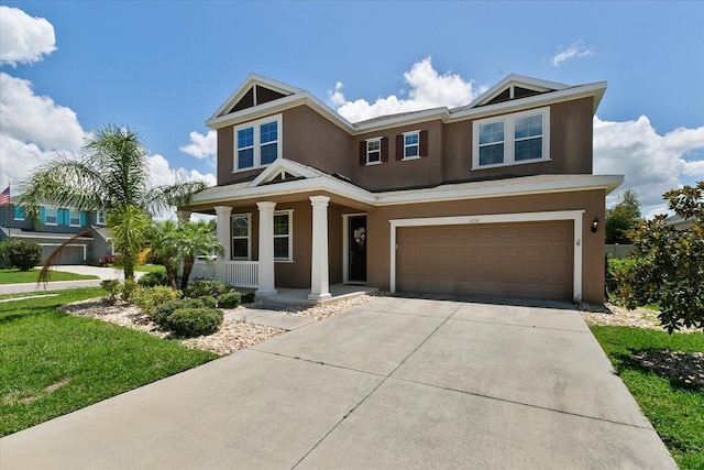 view of front of property with covered porch and a garage