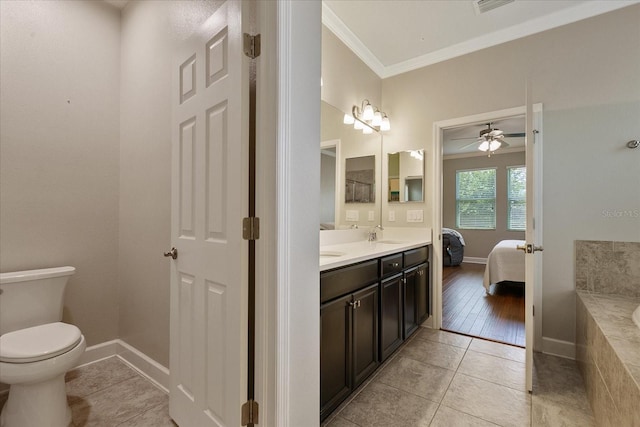 bathroom featuring ceiling fan, tile patterned flooring, crown molding, toilet, and vanity