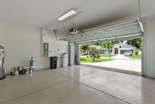 garage with electric panel, electric water heater, and a garage door opener