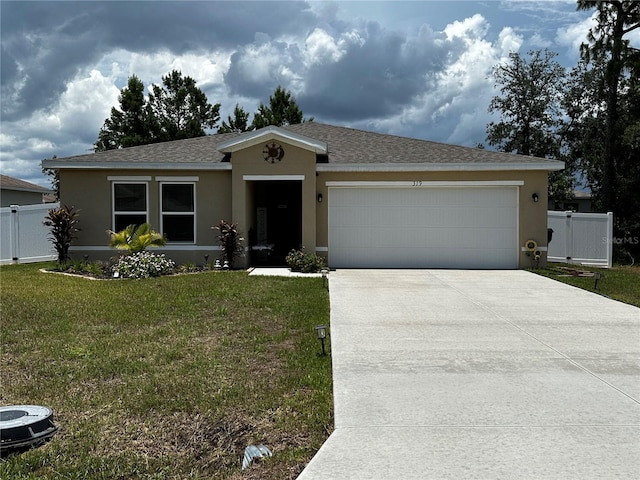 ranch-style home featuring a garage and a front yard