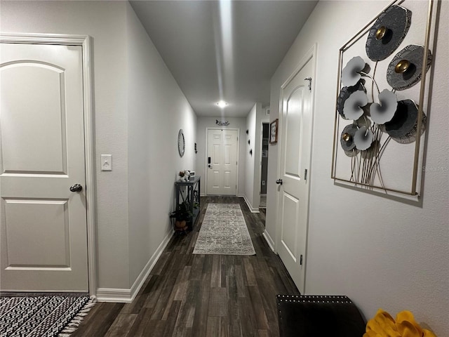 hall with dark hardwood / wood-style flooring