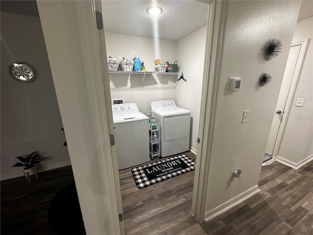 washroom featuring separate washer and dryer and dark hardwood / wood-style flooring